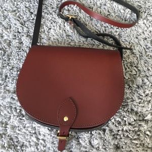 Burgundy leather crossbody saddle bag